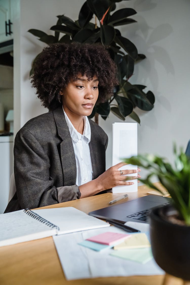 Businesswoman Working On Laptop At Home