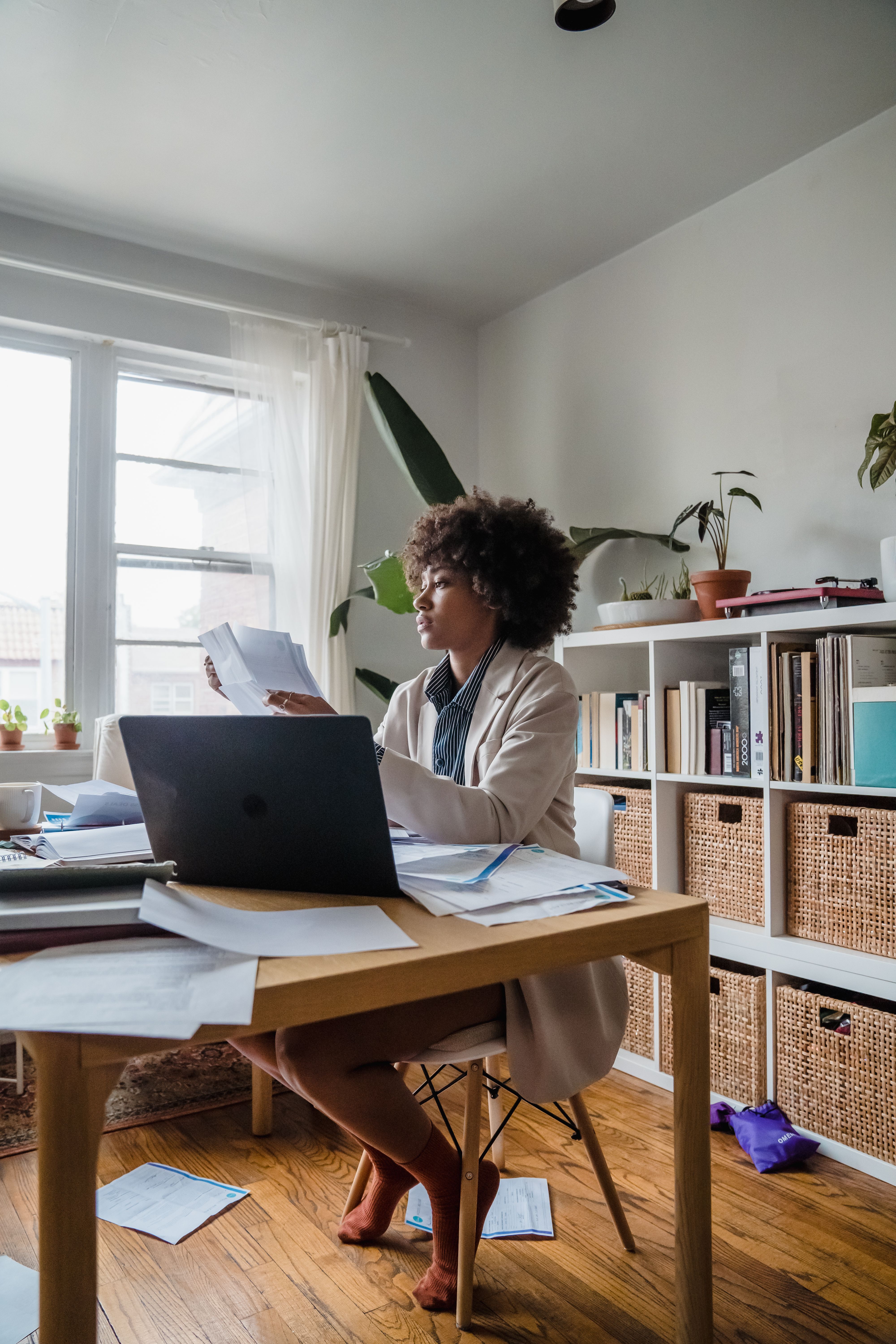 business owner reviewing financial documents at a desk