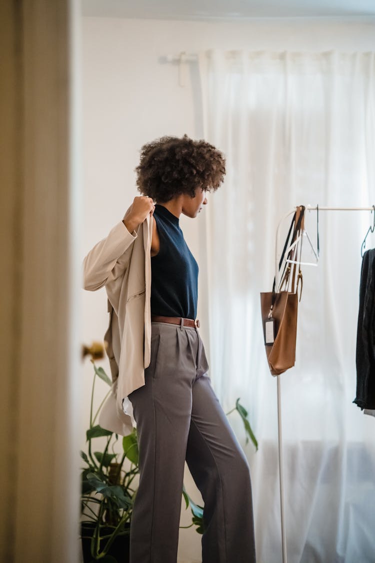 Woman Wearing Clothes In Room