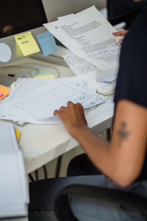 Close-up of a Woman Looking Through Documents in an Office 