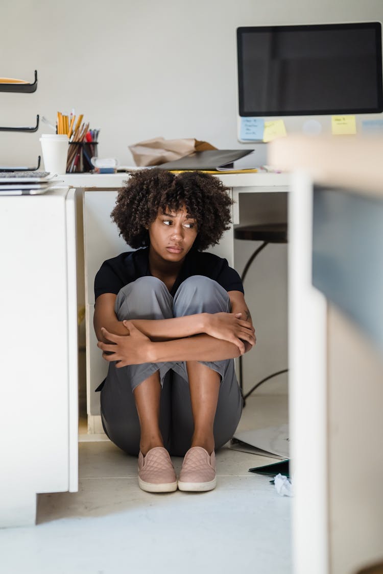 Woman Hiding Under Her Desk