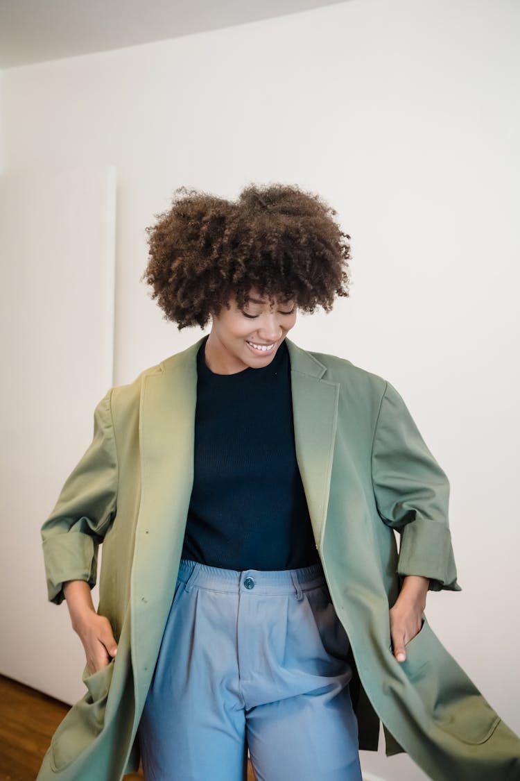 Woman Spinning In Green Coat