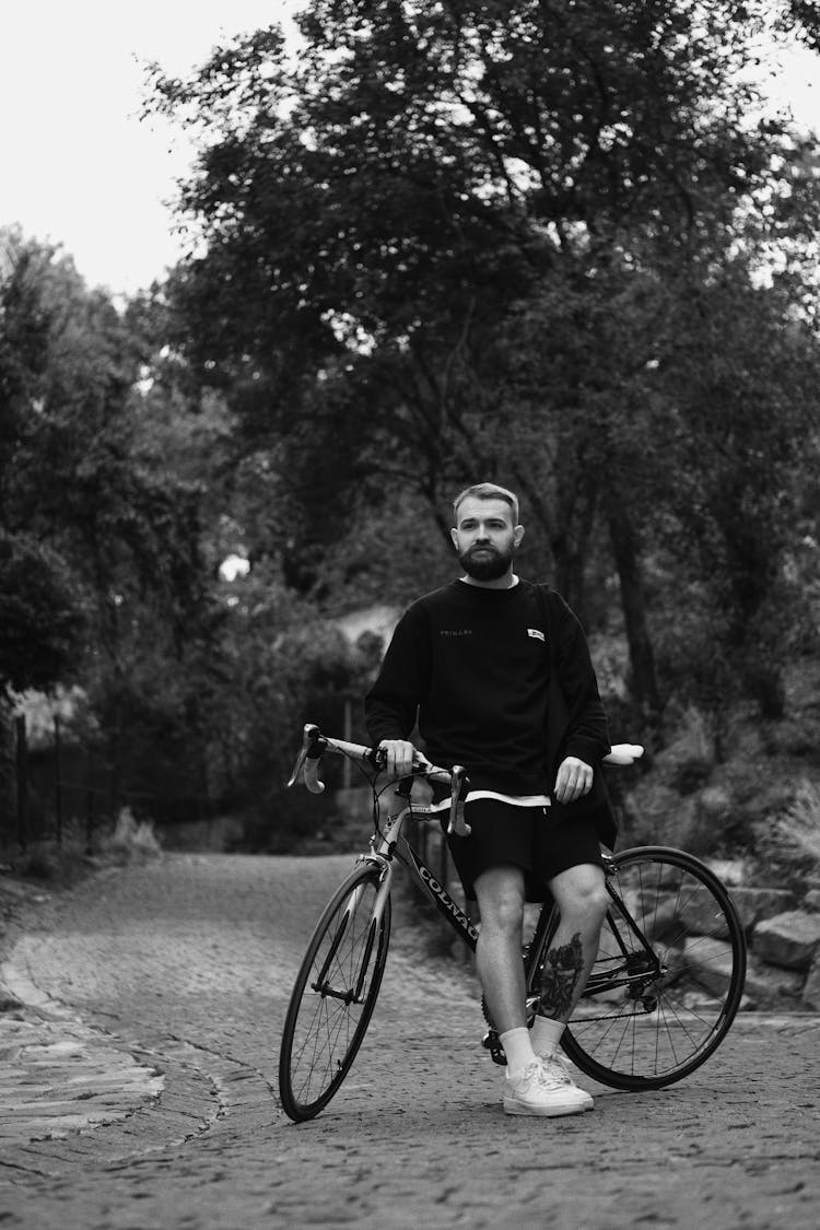 Man With Bicycle In Park