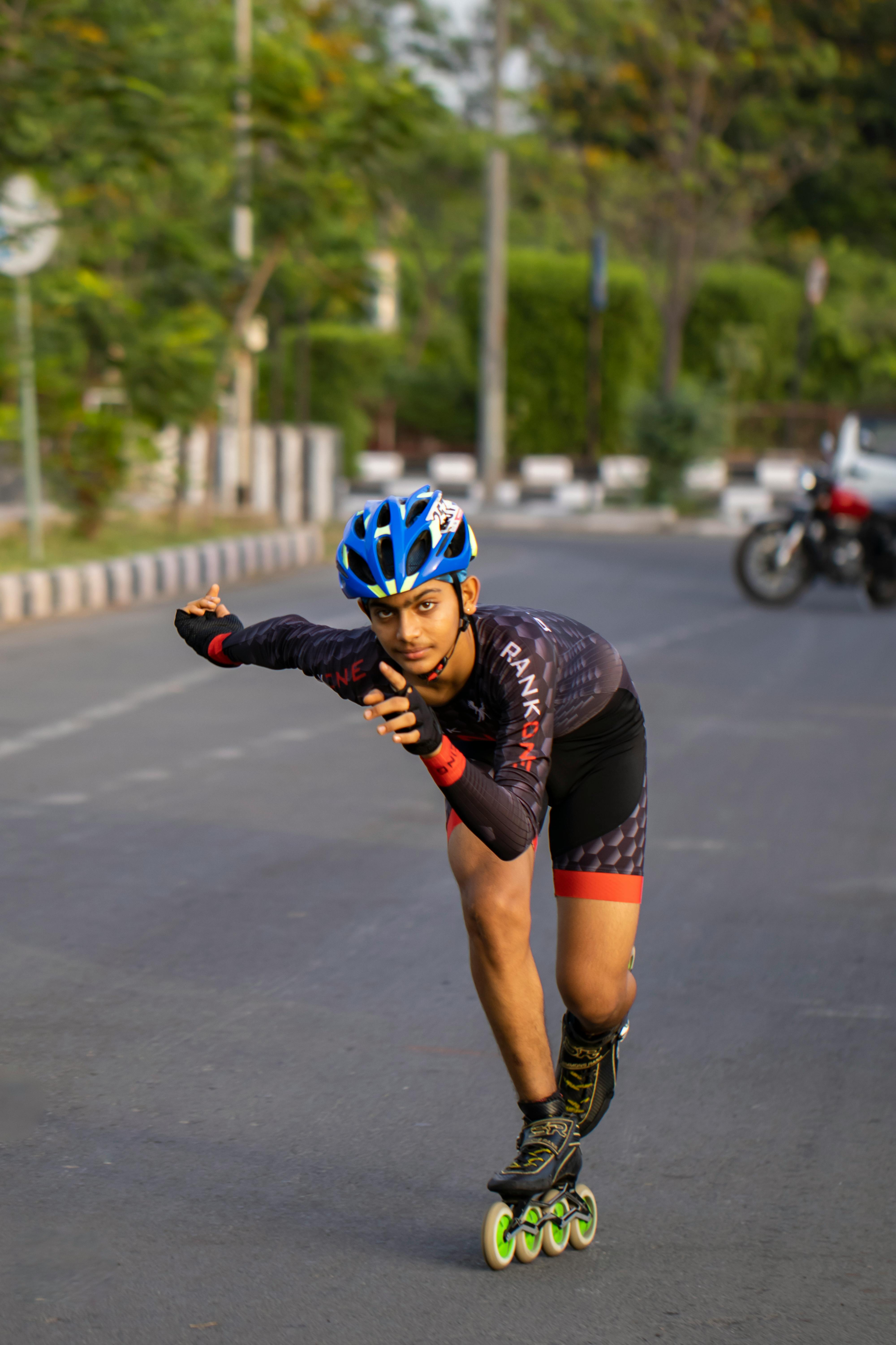 A Man Rollerblading on an Asphalt Road · Free Stock Photo