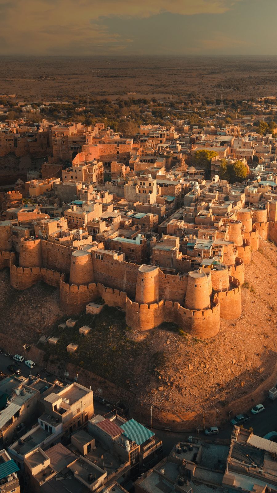 Aerial view of Jaisalmer Fort and the golden sandstone city at sunset