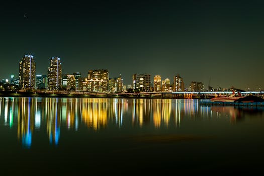 Stunning night view of Seoul's skyline with vibrant reflections on the calm river.