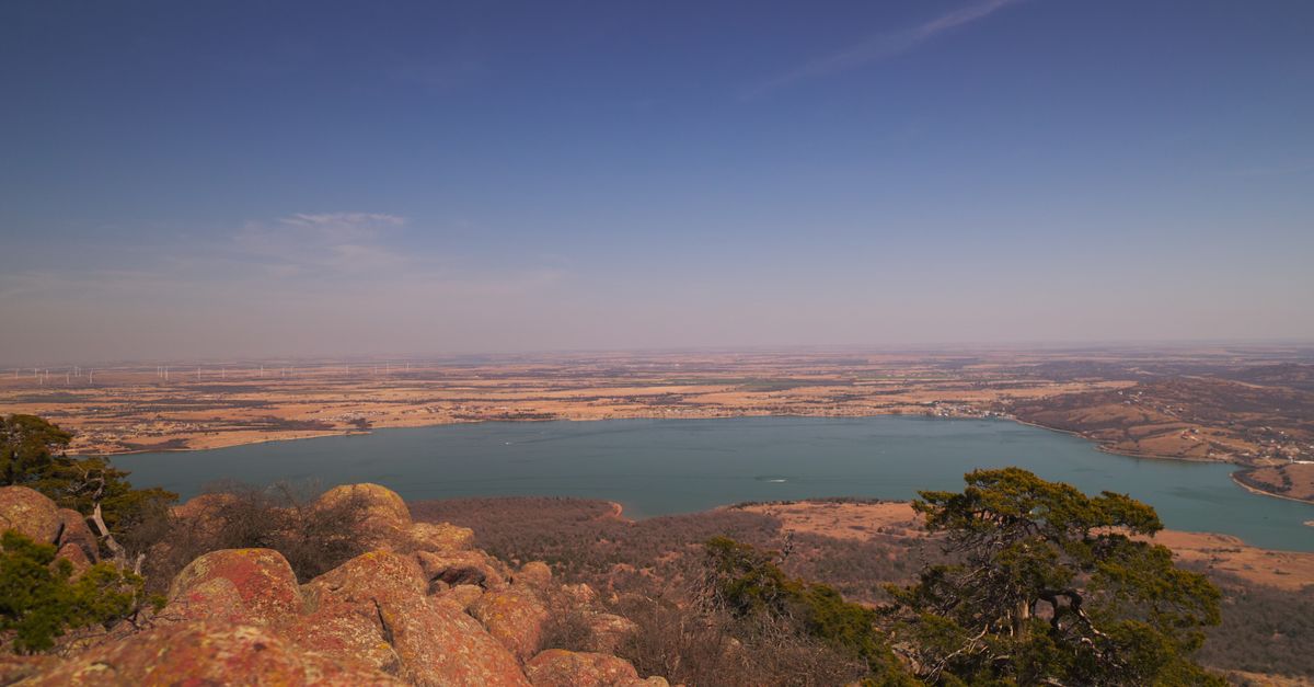 Breathtaking panoramic view of Lake Lawtonka and surrounding landscape from a mountain top in Oklahoma.