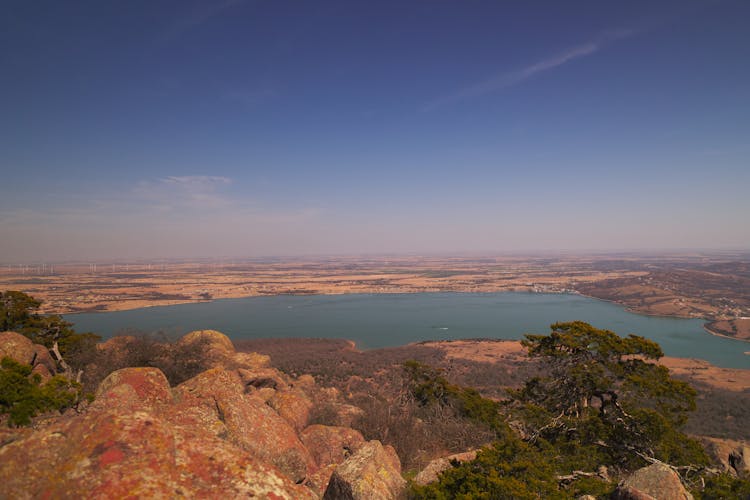 A View Of A Lake From A Mountain