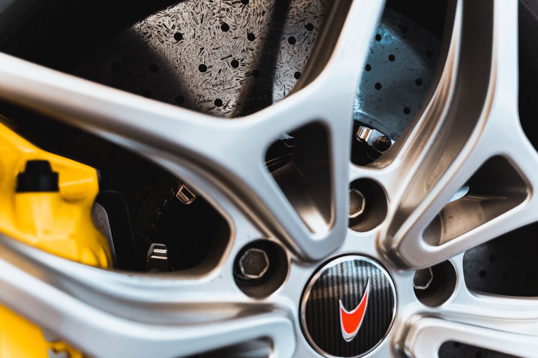Performance car wheel with yellow brake calipers