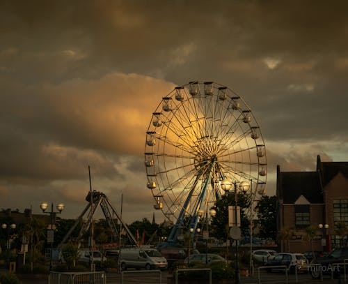 A Ferris Wheel under a Cloudy Sky