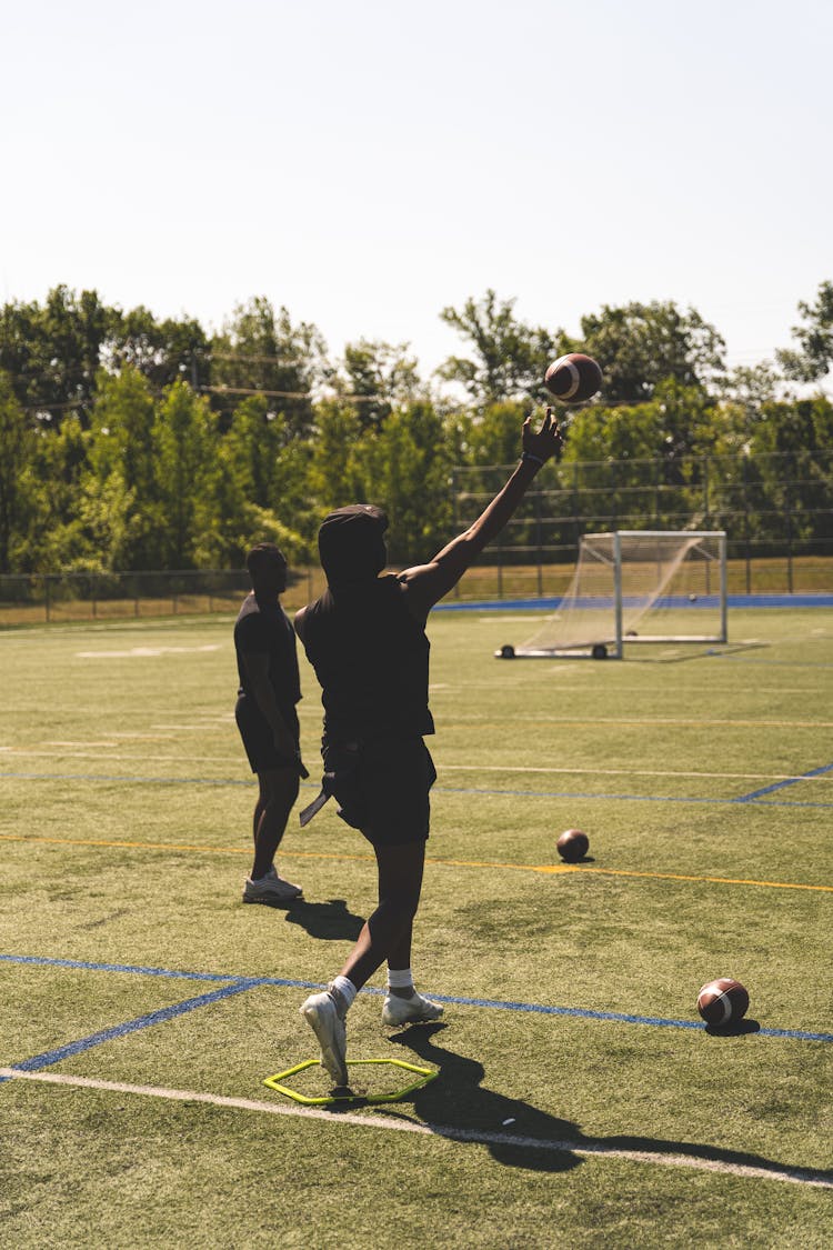 A Man Throwing A Football