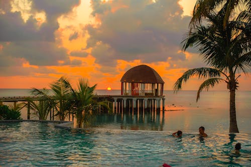 People Swimming on Infinity Pool in Kudafushi Resort, Villingili, Maldives