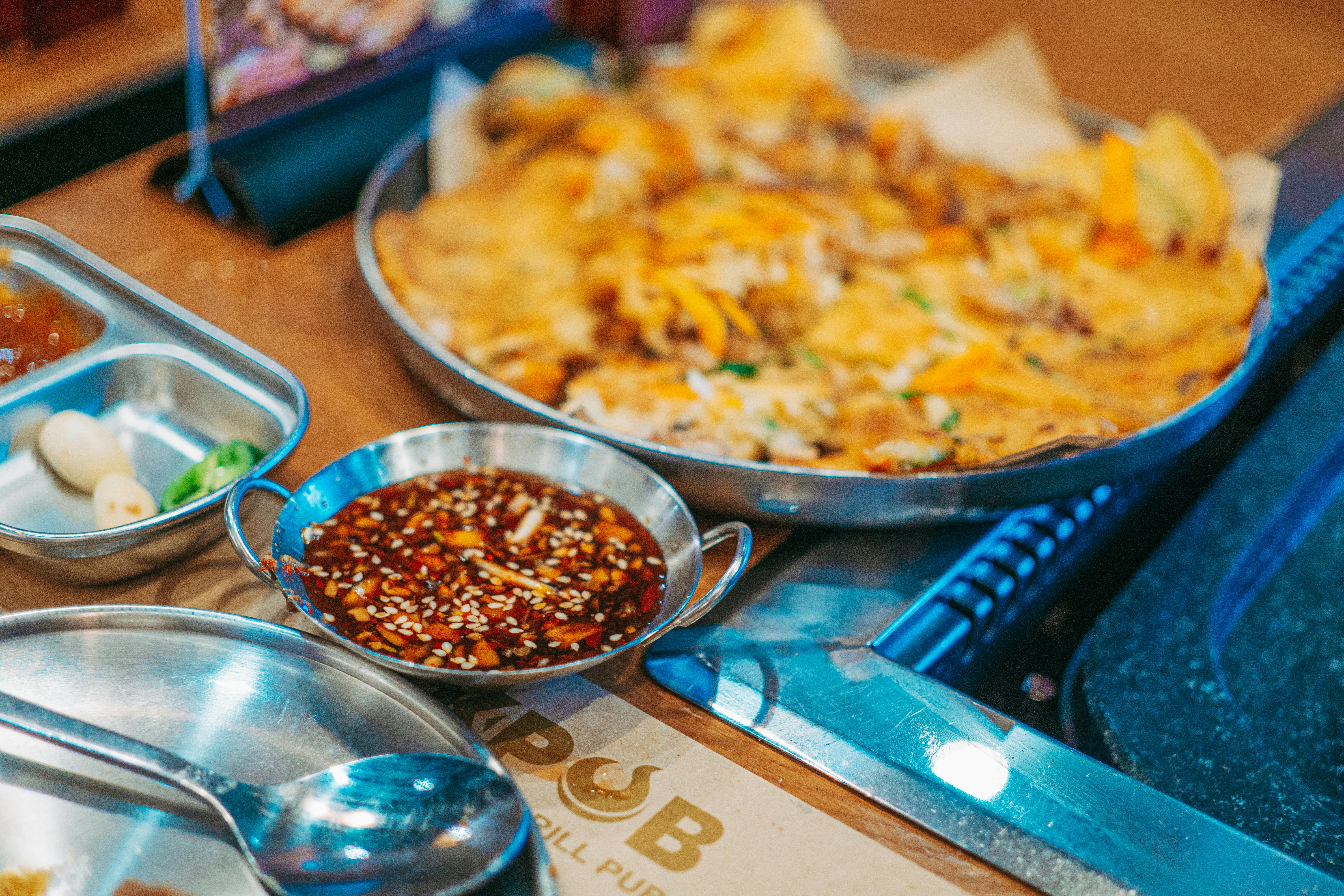 Close-up of a delicious Asian dish with spicy sesame sauce, ideal for food enthusiasts.