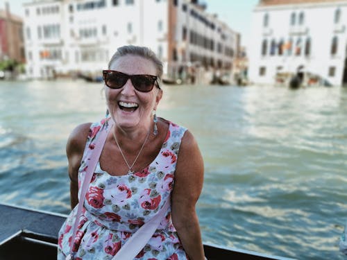 Portrait of Happy Old Woman in City on Water