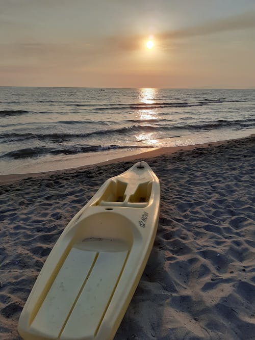 A Kayak on a Beach during the Golden Hour