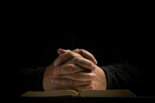 Woman Praying in the Dark 