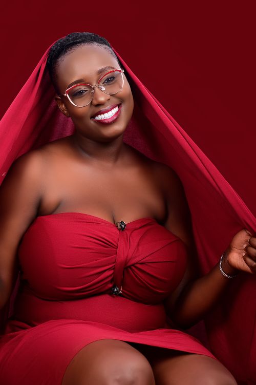 Free A joyful portrait of a woman in stylish red attire, exuding elegance and warmth. Stock Photo