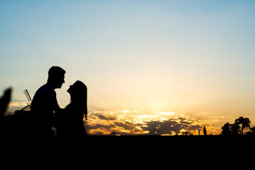 Silhouette of a Romantic Couple during Sunset