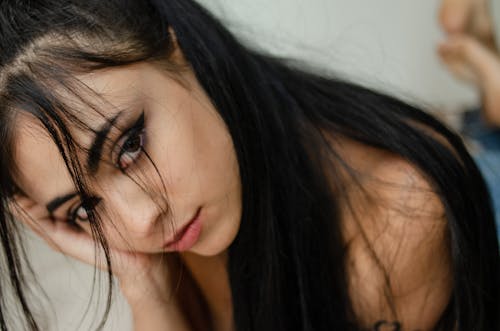 Close Up Photo of Woman with Dark Hair