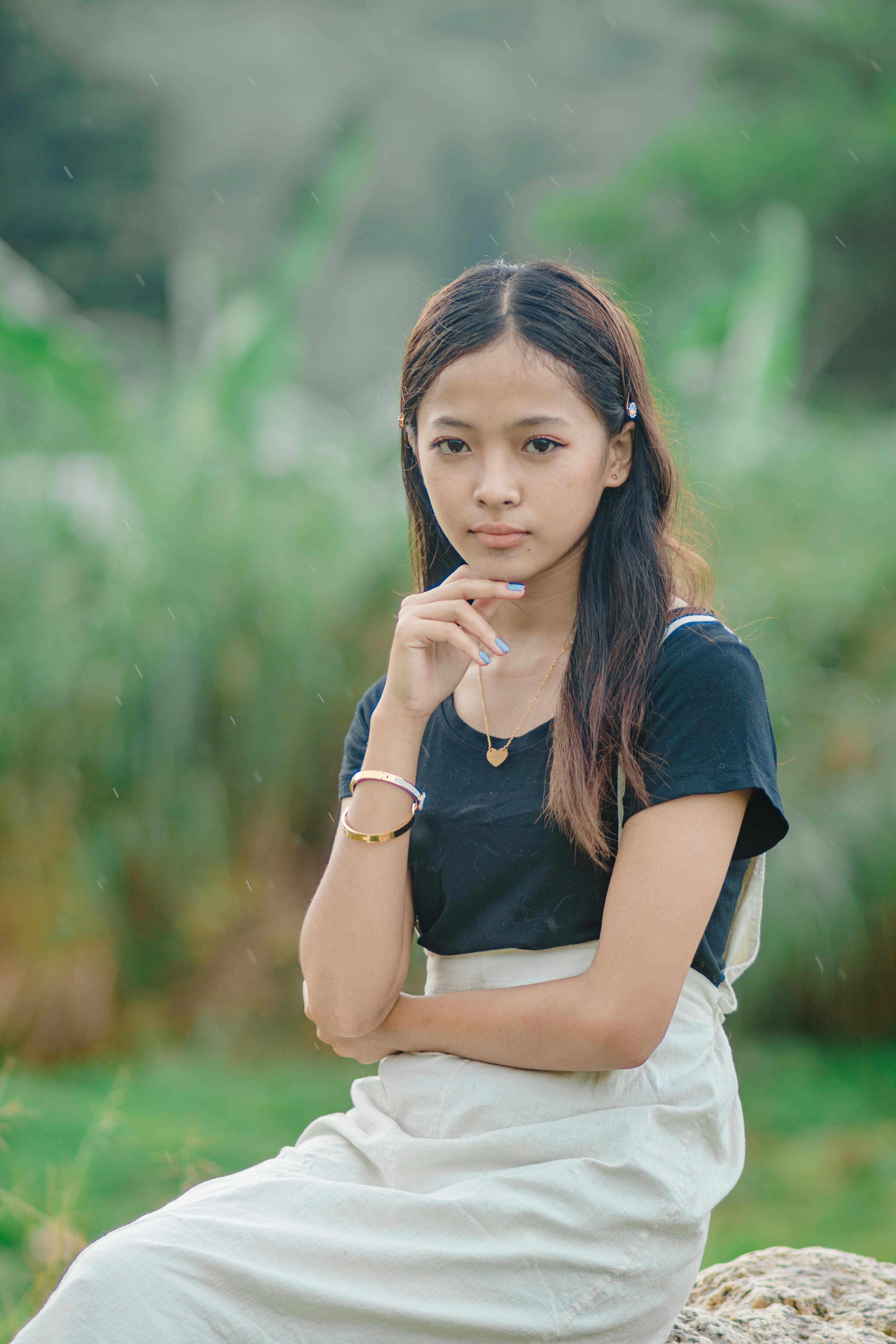 Girl in White Tank Top and Red and Black Plaid Skirt · Free Stock Photo