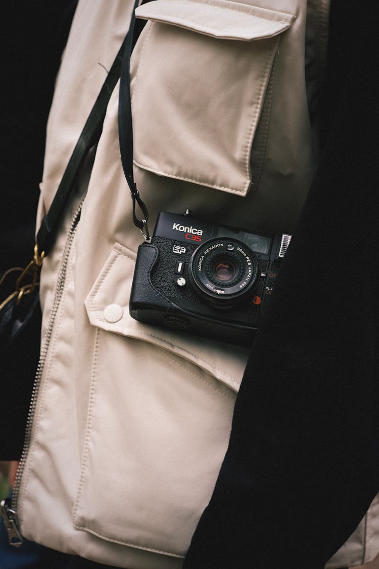 Retro Camera Hanging On Person Shoulder