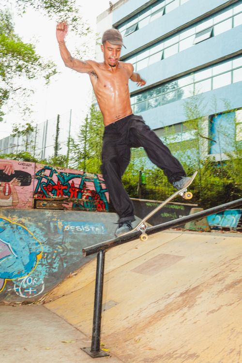Free A young man skateboarding on a rail in an urban skatepark, showcasing a cool trick. Stock Photo