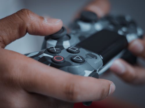 Close-Up Shot of a Person Holding a Game Controller