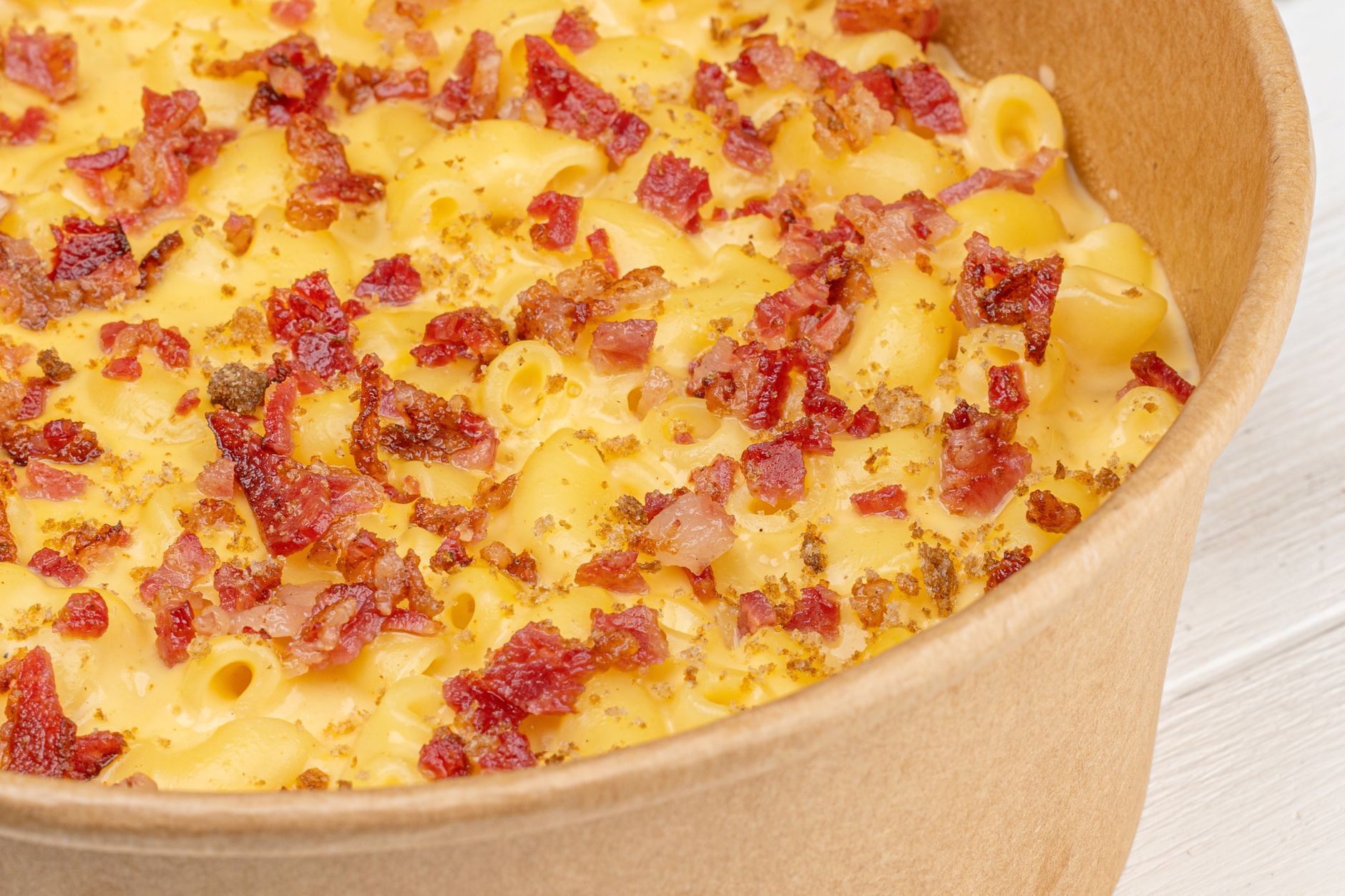 Golden baked Mexican Mac-n-Cheese in a glass dish