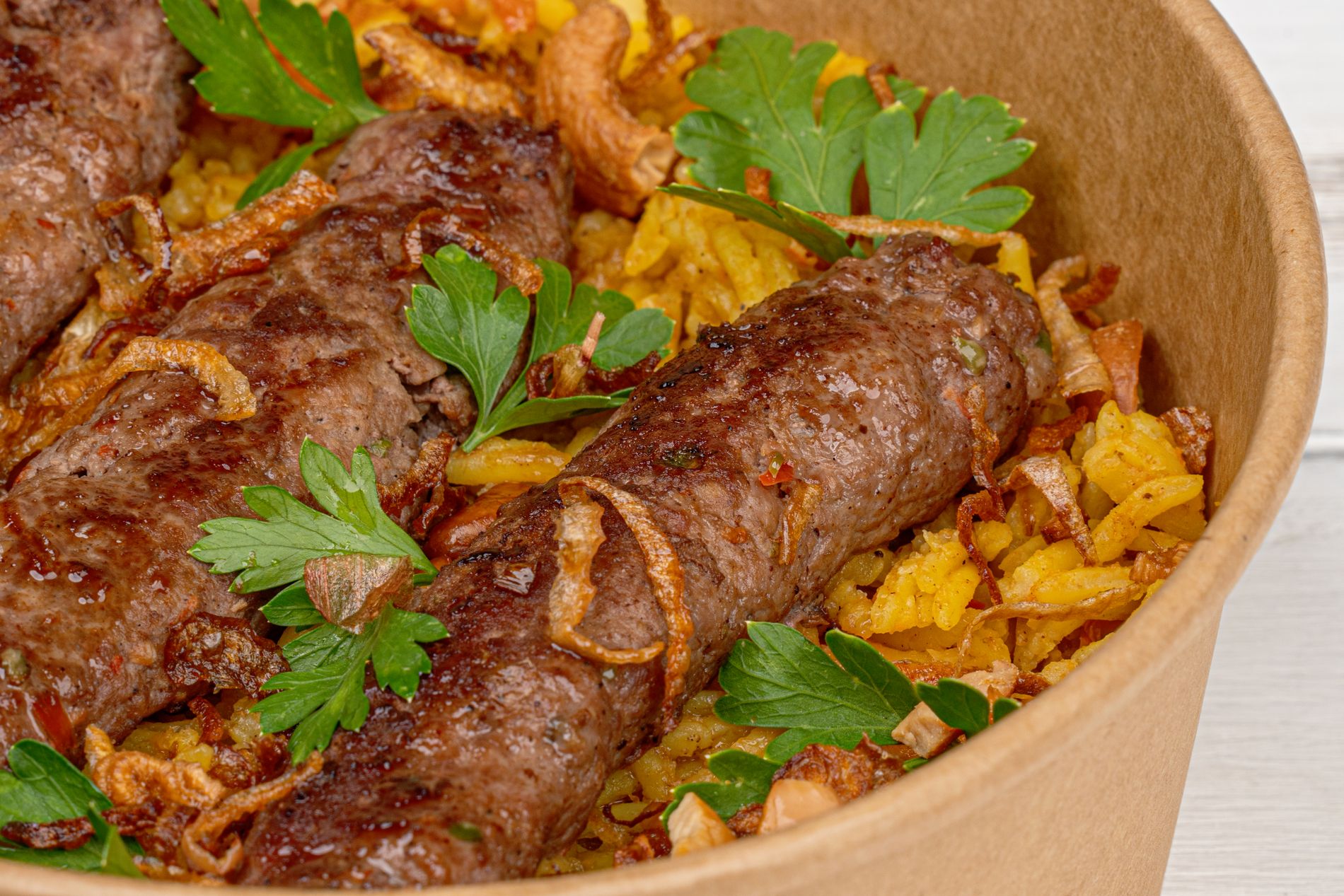 Middle Eastern beef kebab served over fragrant rice
