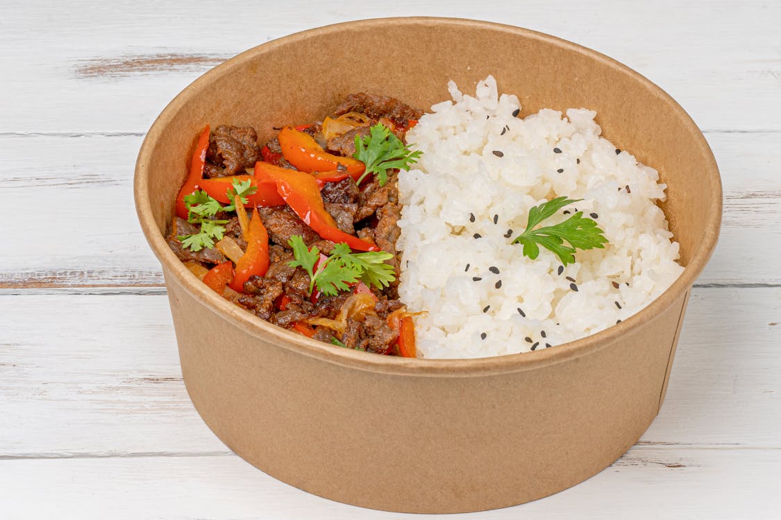 Free Cooked Meat with Red Pepper in Brown Paper Bowl Stock Photo