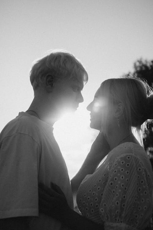 Free Grayscale Photo of A Couple Looking at Each Other Stock Photo