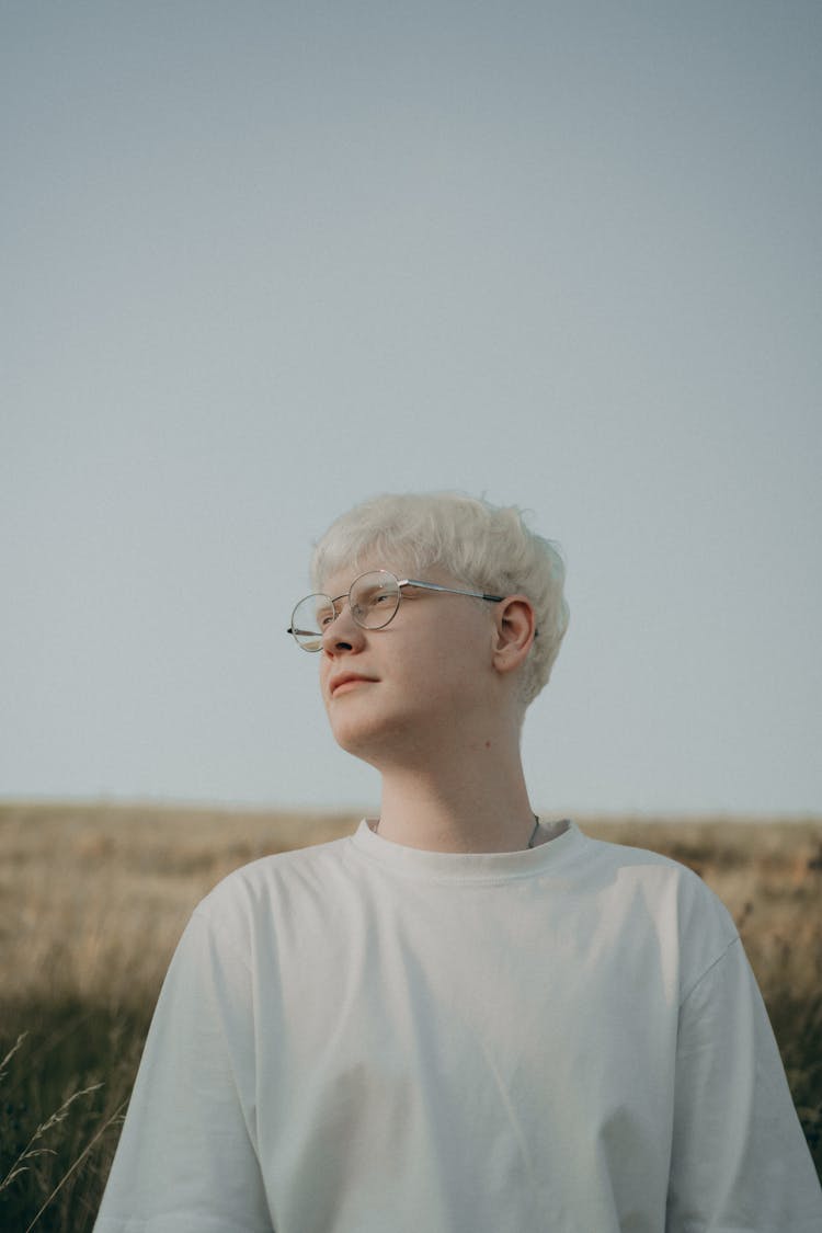 Albino Man Posing In Field