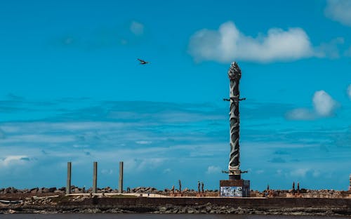 Gray Concrete Post Under the Blue Sky