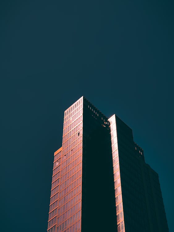 Skyscraper Under Dark Sky · Free Stock Photo