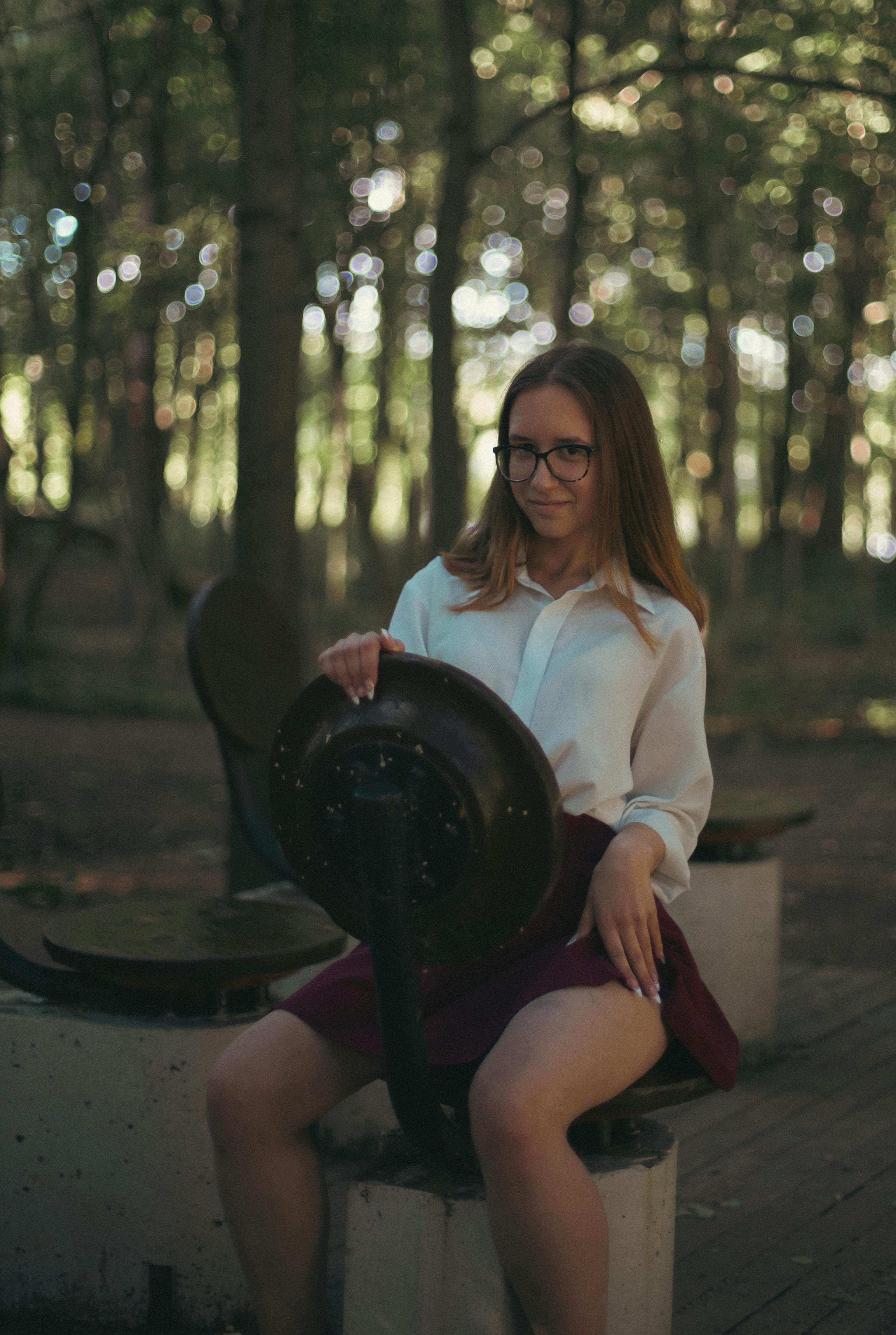 Young Long Haired Woman in Dark Green Pea Coat, Pleated Mini Skirt and ...