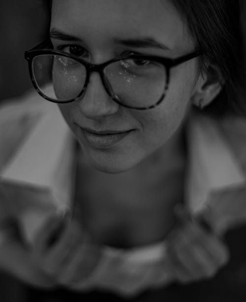 Grayscale Image of Woman in Black Framed Eyeglasses