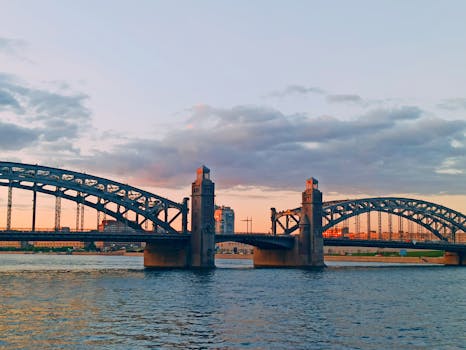 Scenic view of the Bolsheokhtinsky Bridge during sunset over the Neva River in St. Petersburg, Russia.