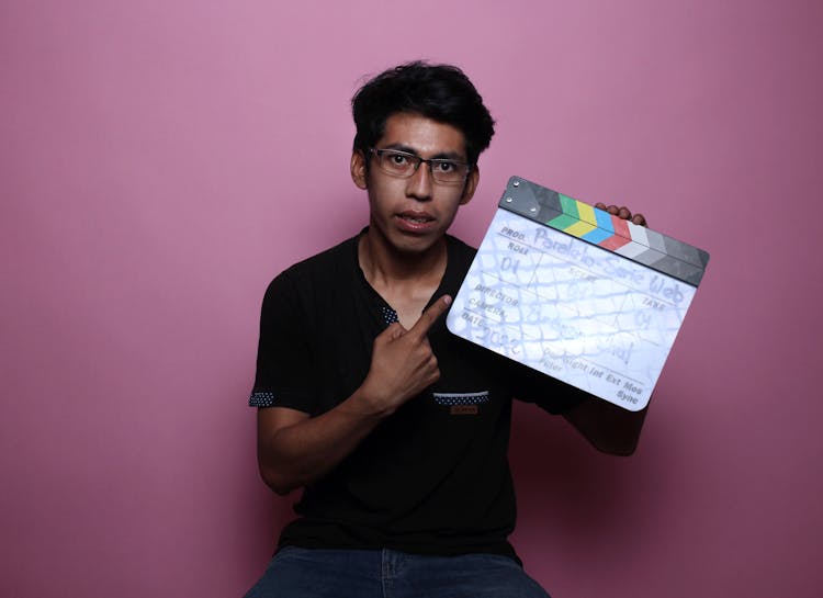 A Man Holding A Clapperboard