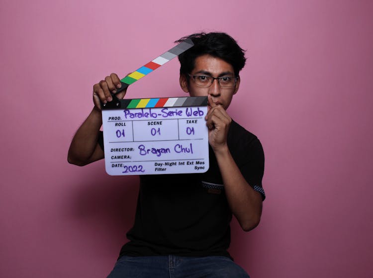 A Man Holding A Clapperboard