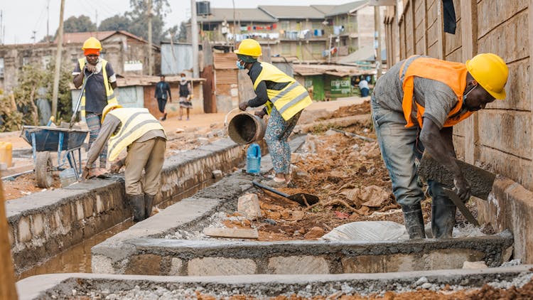 Construction Workers Making A Drainage