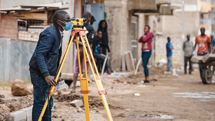 A Man Surveying The Street