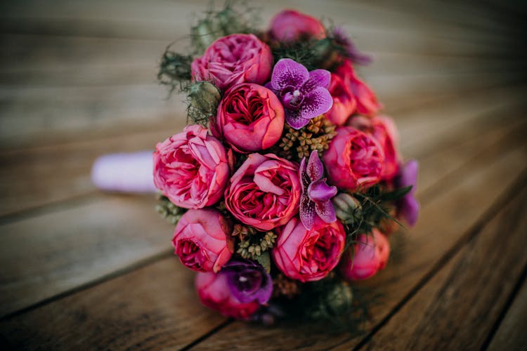 Close-up Of Flowers Bouquet On Wooden Table