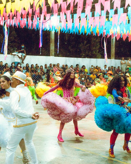 Dancers Dancing in Colorful Clothes