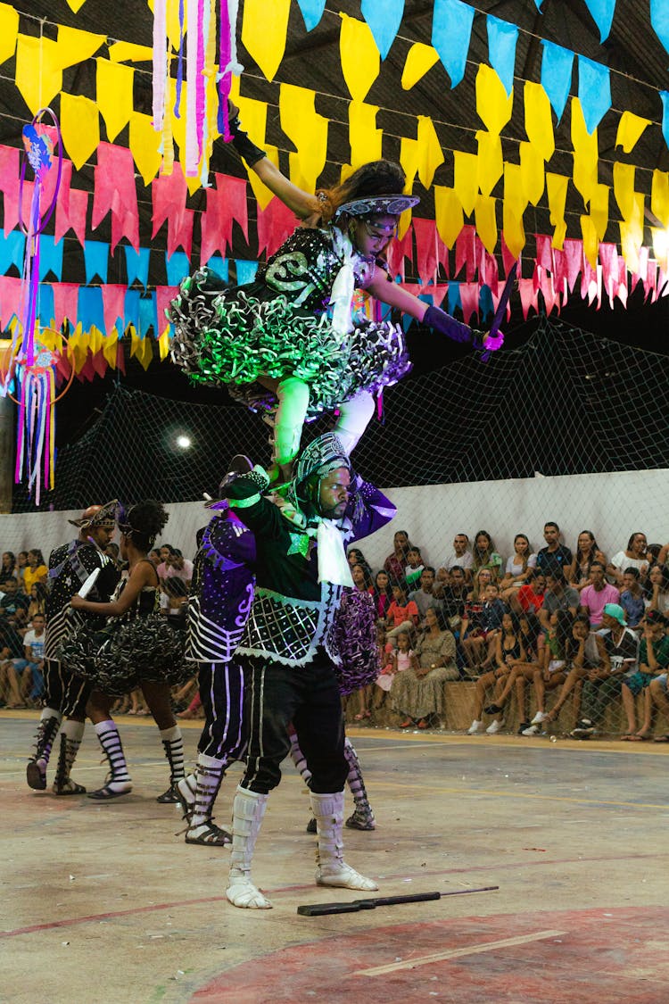 Acrobats Performing In Costumes