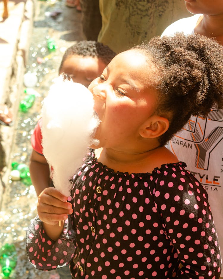 Cute Child Eating Cotton Candy