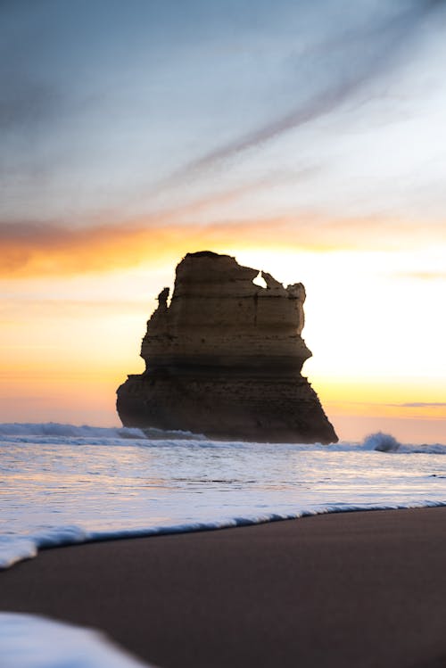 Rock Formation Seen from Beach at Sunset