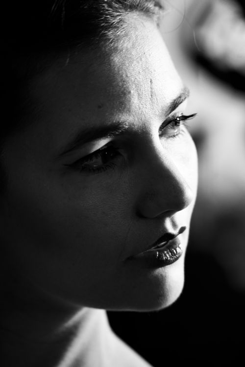 Free Artistic black and white portrait of a woman highlighting expression and mood. Stock Photo