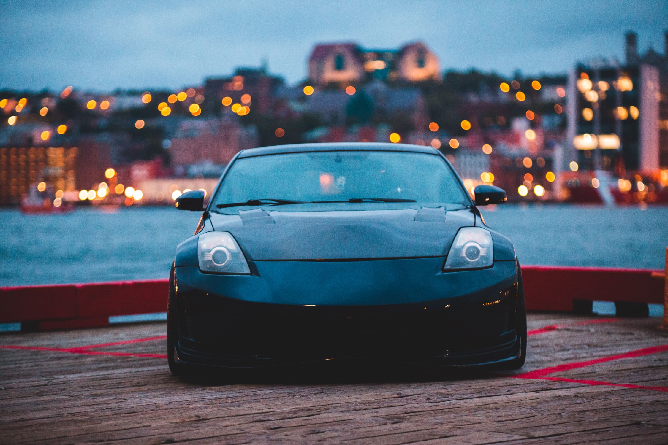 Photo of Nissan 350z Parked on Boardwalk · Free Stock Photo