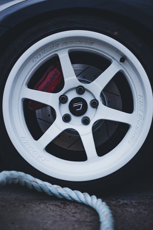 Close Up Photo of a White Mags with Tires