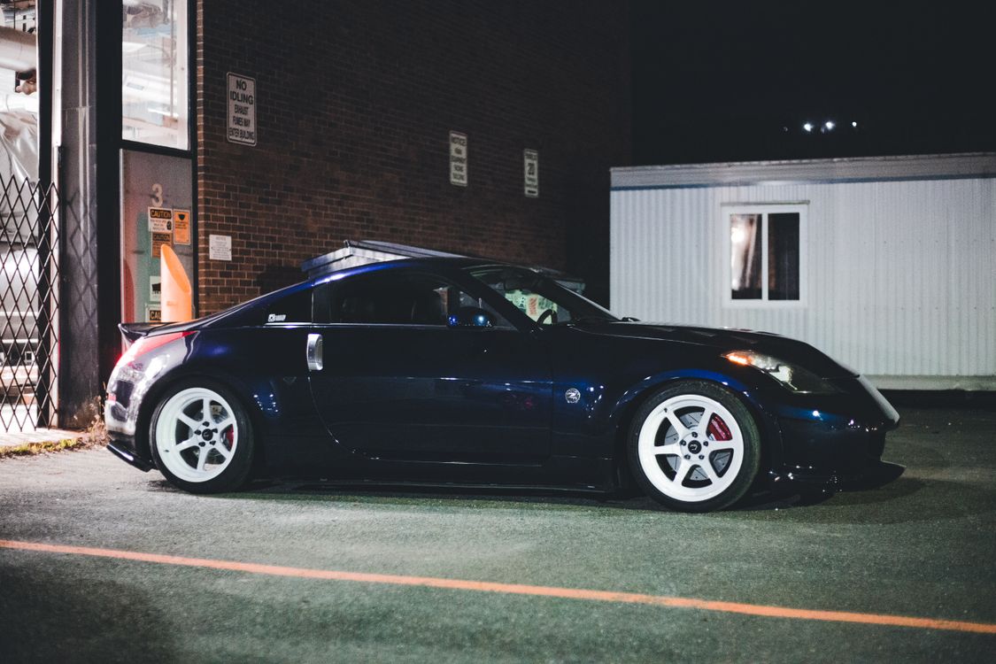 Nissan Vehicle Parked on a Parking Lot · Free Stock Photo
